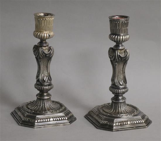 An ornate pair of 1960s cast silver candlesticks by A. Haviland-Nye, 28.5 oz